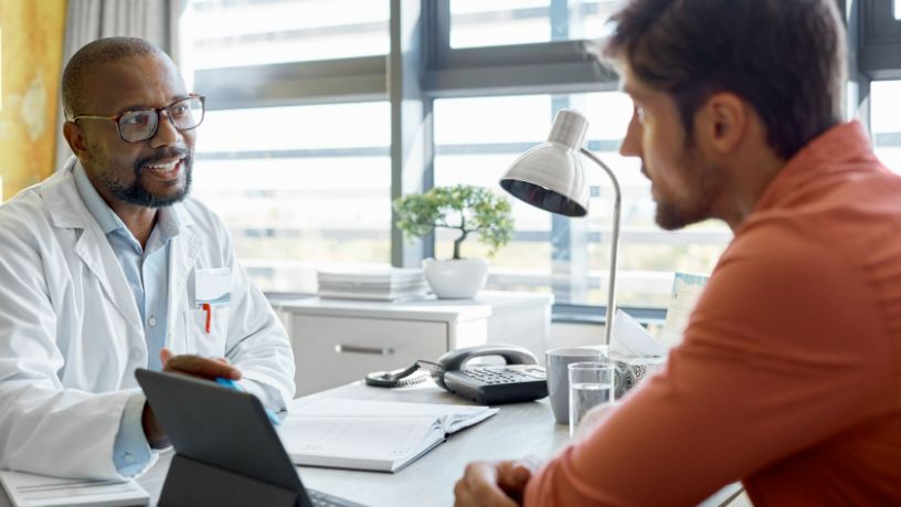 A doctor consults with his patient.