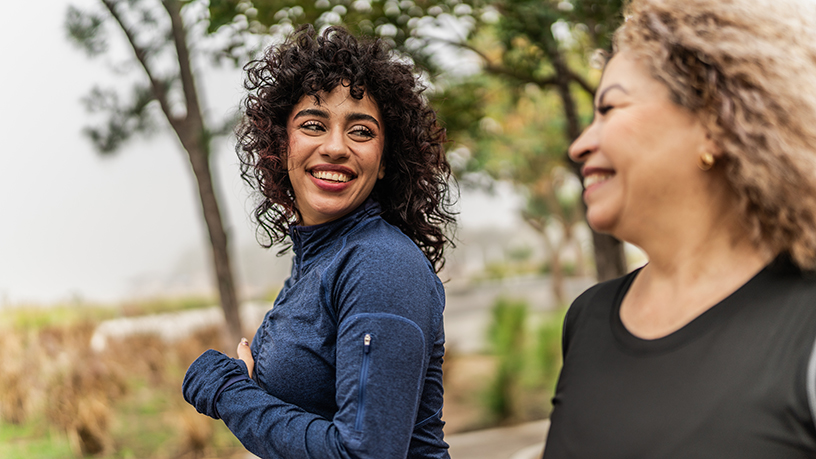 Two women powerwalking together.