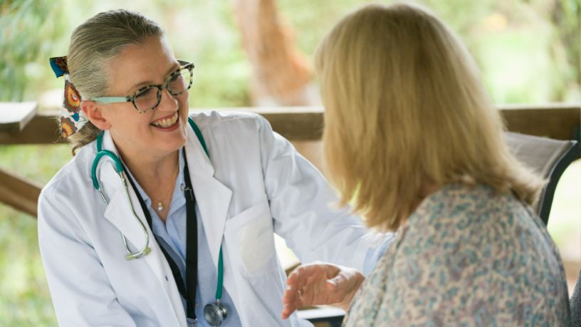 A woman speaks with her doctor.