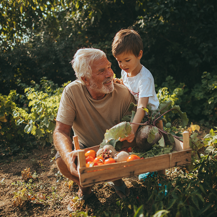 Grandfather and grandson gardening together, symbolising future-focused healthcare partnerships